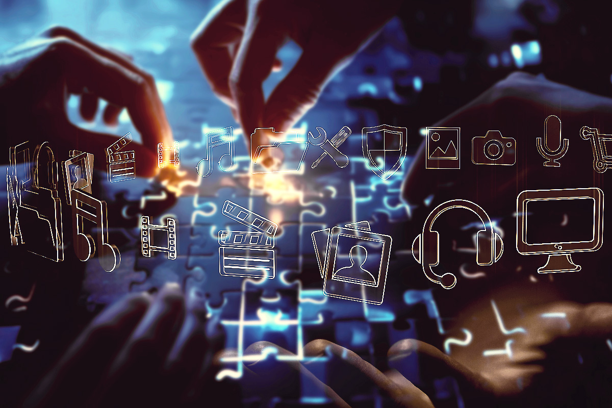 A collaborative digital interface showing multiple hands assembling a glowing puzzle of multimedia icons — including video, audio, and security — representing BeeZee Vision’s COA 2 Deployment phase for partnership scaling and operational oversight. Alt Text (Spanish): Una interfaz digital colaborativa que muestra varias manos armando un rompecabezas brillante de íconos multimedia — incluyendo video, audio y seguridad — que representa la fase de Despliegue COA 2 de BeeZee Vision para el escalamiento de asociaciones y supervisión operativa.